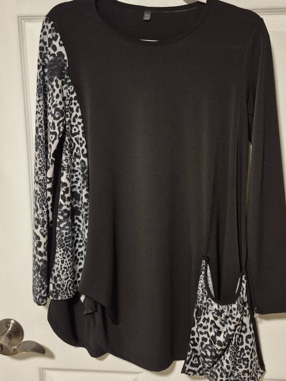 Black and Animal print Tunic Top.   Size S/M Fits to size 12.  Brand unknown